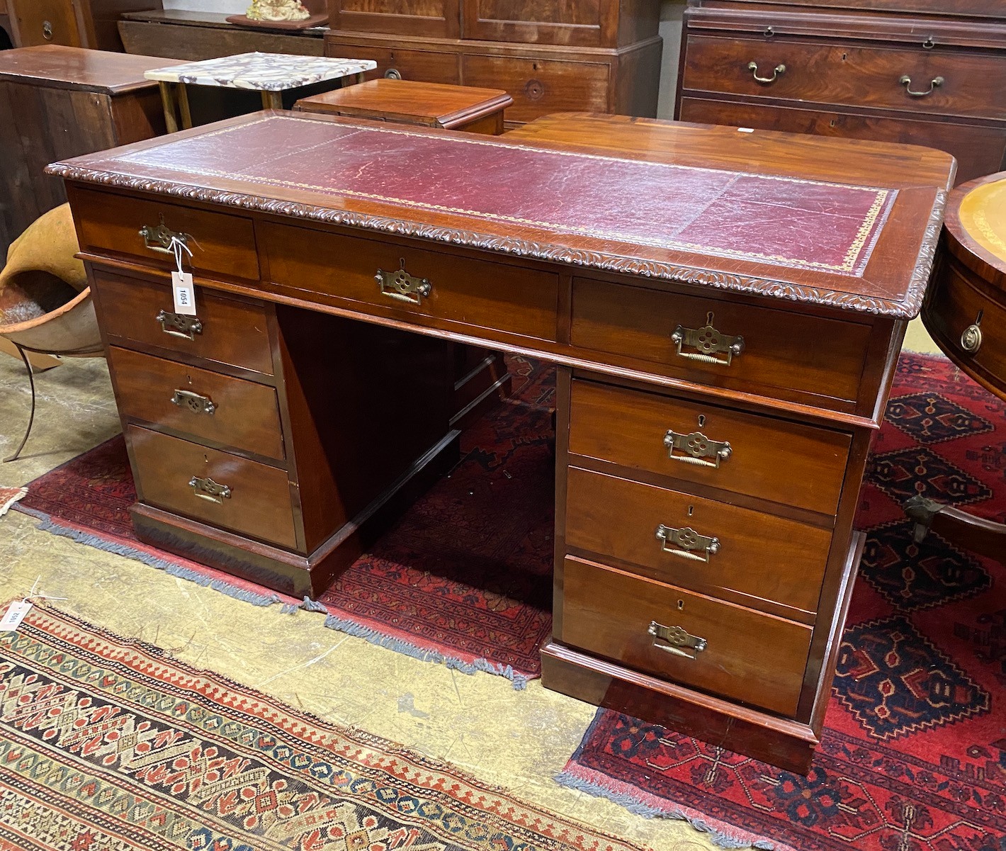 An early 20th century mahogany pedestal desk, width 136cm, depth 59cm, height 77cm